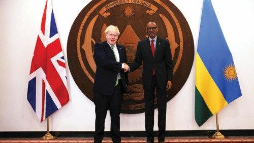 FILE PHOTO: British Prime Minister Boris Johnson shakes hands with Rwandan President Paul Kagame ...