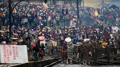 TOPSHOT - Demonstrators clash with riot police nearby El Ejido park, in Quito, on June 24, 2022, in ...