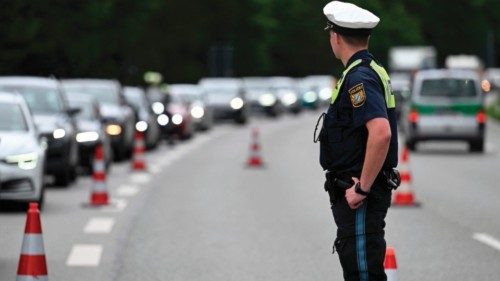 A police officer surveys the traffic at a police control point near Garmisch-Partenkirchen, southern ...