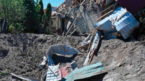 A photograph shows a crater caused by missile strikes which struck a residential area of Kharkiv on ...