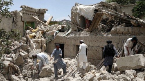FILE PHOTO: Afghan men search for survivors amidst the debris of a house that was destroyed by an ...