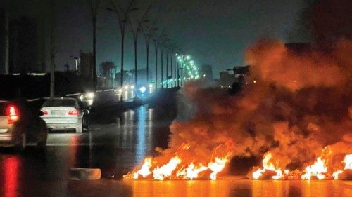 A picture taken on June 3, 2022, shows burning tyres blocking roads during overnight protests in the ... A picture taken on June 3, 2022, shows burning tyres blocking roads during overnight protests in the ...