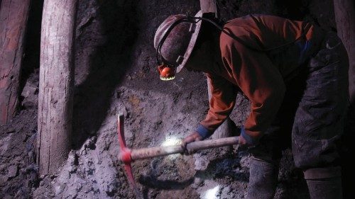 A miner works inside of Cerro Rico, an active silver mine that is slowly sinking and collapsing onto ...