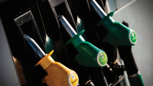 (FILES) This file photo taken on January 24, 2022 shows petrol nozzles at a gas station in ...