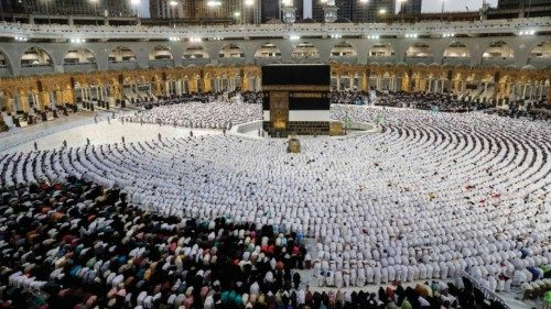 TOPSHOT - Muslim worshippers and pilgrims (white) pray around the Kaaba, Islam's holiest shrine, at ...