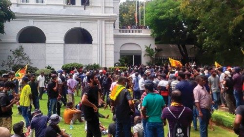 Protestors gather inside the compound of Sri Lanka's Presidential Palace in Colombo on July 9, 2022. ...