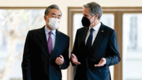 US Secretary of State Antony Blinken (R) and China's Foreign Minister Wang Yi talk before a meeting ...