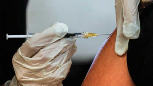 Health workers administer a Pfizer COVID-19 vaccine booster shot at the COVID-19 vaccination hub of ... Health workers administer a Pfizer COVID-19 vaccine booster shot at the COVID-19 vaccination hub of ...
