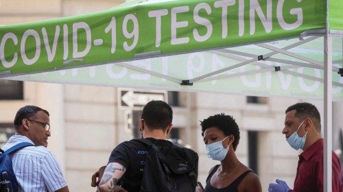 FILE PHOTO: People wait to take coronavirus disease (COVID-19) tests at a pop-up testing site in New ...