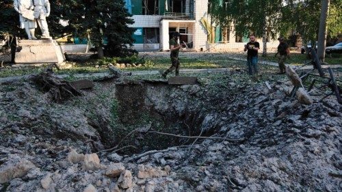 TOPSHOT - Residents observe the hole and the damage caused in the House of the Culture, in ...