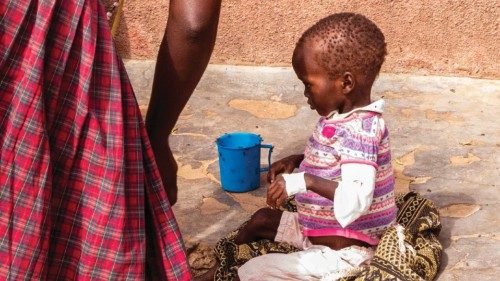 Mothers stay with malnourished children at Kaabong hospital in Kaabong, Karamoja region, Uganda, on ...