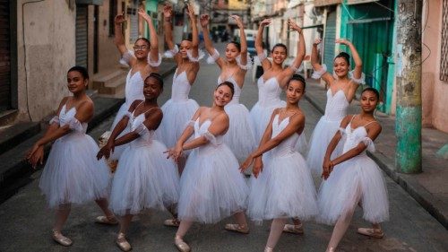 Students of the Ballet Manguinhos School practice dance movements after a photo session at the ...