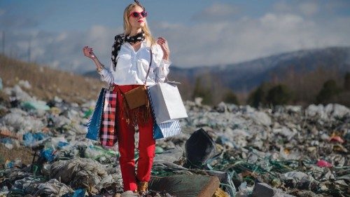 Fashionable modern woman on landfill, consumerism versus pollution concept.