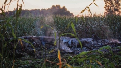 Debris is seen at the crash site of an Antonov An-12 cargo plane owned by a Ukrainian company, near ...