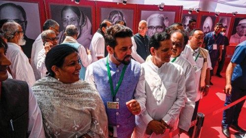 Member of Parliaments wait in a queue to vote the next Indian president at Parliament House in New ...