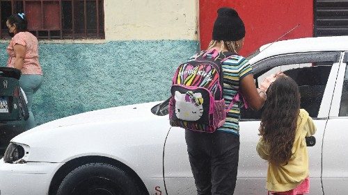 Cuban migrant Diana Rosa Guzman, 48, and her granddaughter Brianna, 6, beg a taxi driver for money ...