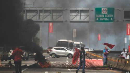 TOPSHOT - Union workers block a highway in Panama City, on July 18, 2022. - Panama's government and ...