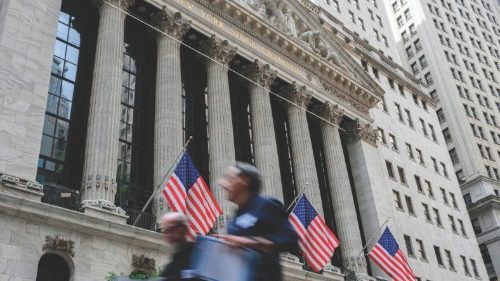 In this file photo taken on July 12, 2022, people walk past the New York Stock Exchange (NYSE) on ... In this file photo taken on July 12, 2022, people walk past the New York Stock Exchange (NYSE) on ...