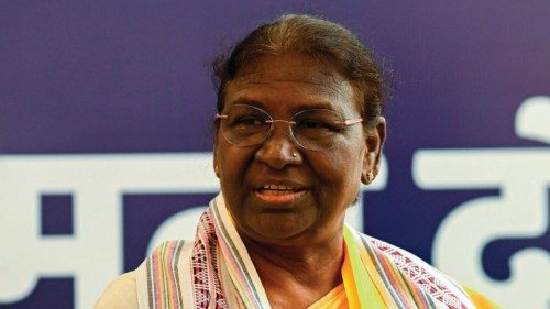 India's President elect Droupadi Murmu (C) attends an event at her temporary residence after she was ...