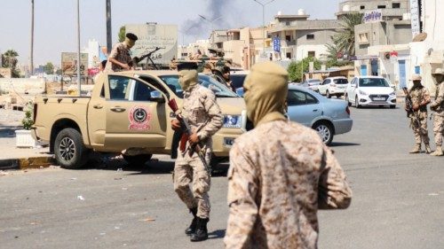 Members of the Libyan armed unit, 444 Brigade, backing the Government of National Unity (GNU) and ...