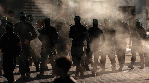 Masked members of the al-Qassam Brigades, the military wing of Hamas, march during a rally in Gaza ...