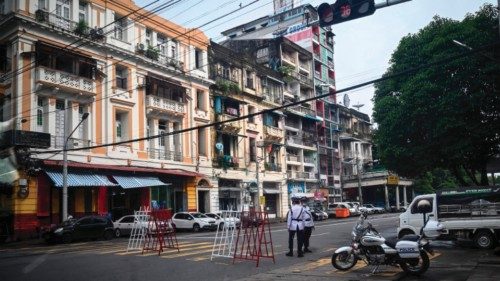 Traffic police stand guard on a street in Yangon on July 19, 2022, on the 75th Martyrs' Day that ...