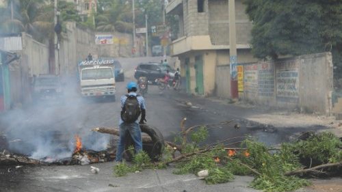 A man holds a tire at a road block as demonstrators blocked streets to protest ongoing fuel ... A man holds a tire at a road block as demonstrators blocked streets to protest ongoing fuel ...