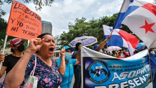 Demonstrators with Panama's national flags take part in a protest against the high cost of food and ...