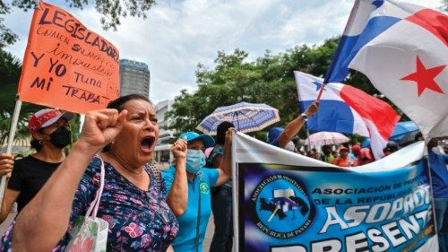 Demonstrators with Panama's national flags take part in a protest against the high cost of food and ... Demonstrators with Panama's national flags take part in a protest against the high cost of food and ...