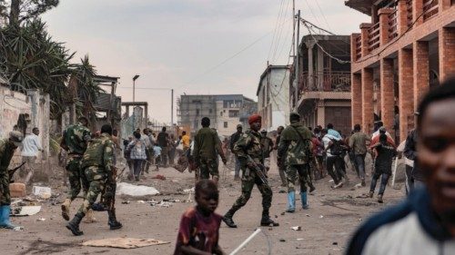 This image taken in Goma on July 26, 2022 shows Congolese soldiers intervening as demonstrators ...
