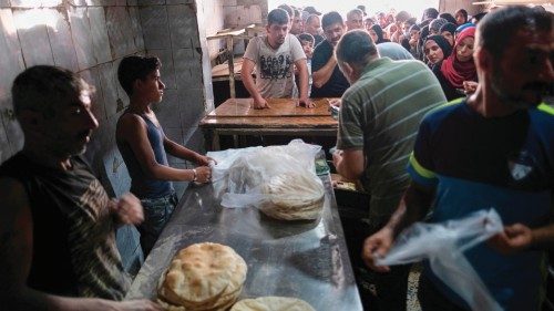 Long lines form early on July 27, 2022 outside a bakery in north Lebanon's port city of Tripoli ... Long lines form early on July 27, 2022 outside a bakery in north Lebanon's port city of Tripoli ...