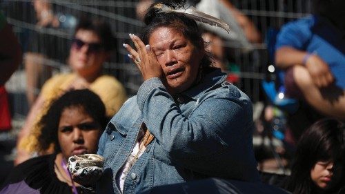 An indigenous woman cries as Catholic faithful listen to Pope Francis celebrate Mass inside the ...