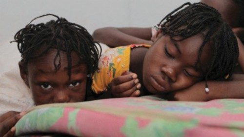 FILE PHOTO: Haitian children who escaped violence in the town of Cite-Soleil are seen as they take ...