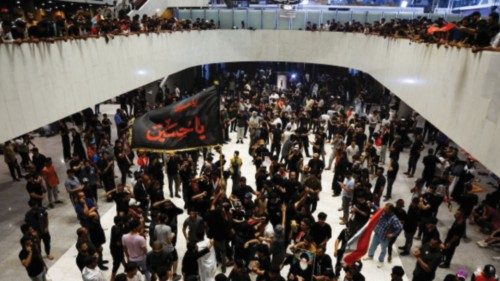 Supporters of Iraqi populist leader Moqtada al-Sadr gather during a sit-in at the parliament ...