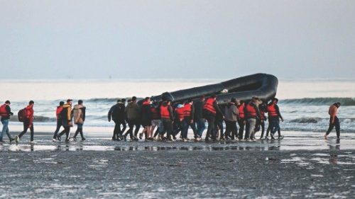 (FILES) This file photo taken on July 11, 2022 about fourty migrants, from various origins, carry an ...