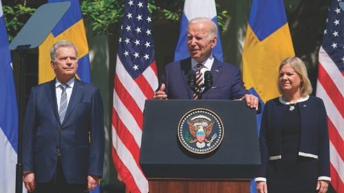 (FILES) In this file photo taken on May 19, 2022 US President Joe Biden, flanked by Swedenâs Prime ...