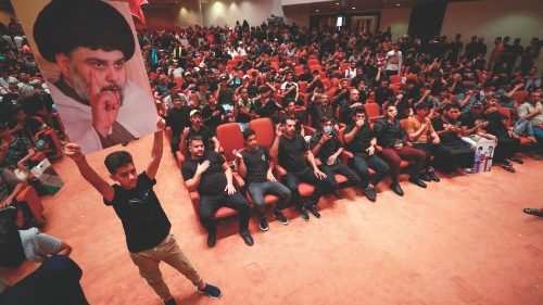 TOPSHOT - Supporters of Iraqi cleric Moqtada Sadr (image), occupy the Iraqi parliament for a fifth ... TOPSHOT - Supporters of Iraqi cleric Moqtada Sadr (image), occupy the Iraqi parliament for a fifth ...
