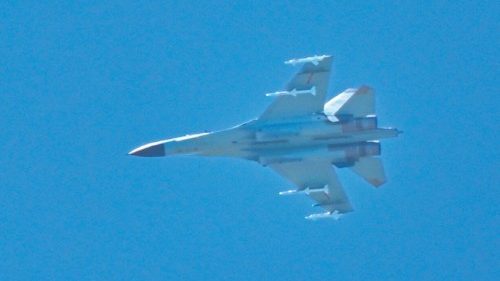 A Chinese military jet flies over Pingtan island, one of mainland China's closest point from Taiwan, ... A Chinese military jet flies over Pingtan island, one of mainland China's closest point from Taiwan, ...