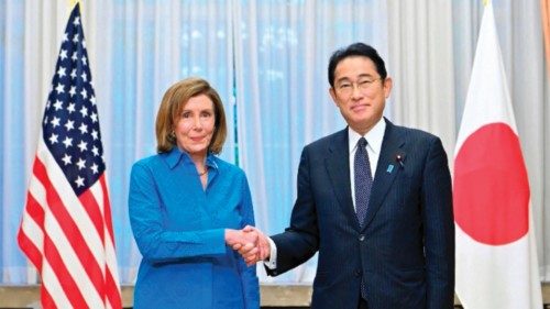 US House Speaker Nancy Pelosi (L) shakes hands with Japanese Prime Minister Fumio Kishida during a ...