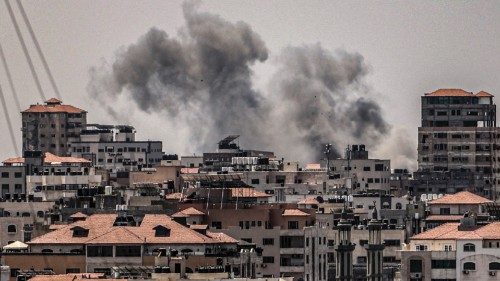 Smoke billows from an Israeli air strike in Gaza City on August 6, 2022. - Israel on August 6 hit ...