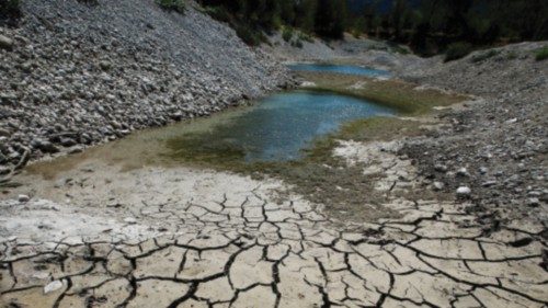 Cracked and dry earth is seen on the banks of Le Broc lake, as a historical drought hits France, ...