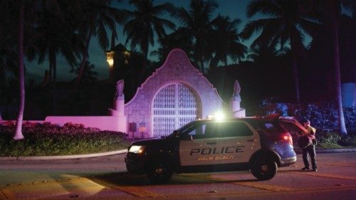 epa10112023 Authorities stand outside Mar-a-Lago, the residence of former president Donald Trump, ...