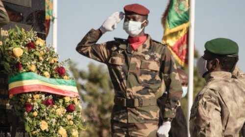 Transitional Malian President, Colonel Assimi Goïta (R) looks on after laying a wreath on the ...