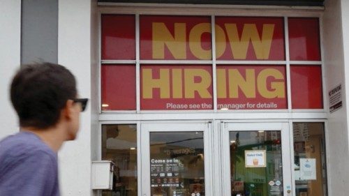 MIAMI, FLORIDA - NOVEMBER 05: A ''Now Hiring' sign hangs above the entrance to a McDonald's ...