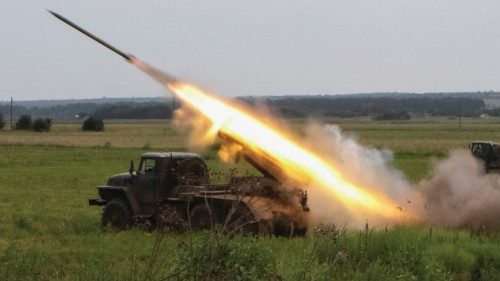 Ukrainian servicemen fire with a BM21 Grad multiple launch rocket system in a frontline in Kharkiv ...