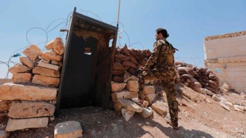 A Turkey-backed Syrian fighter is pictured at a military position on the outskirts of the town of ...