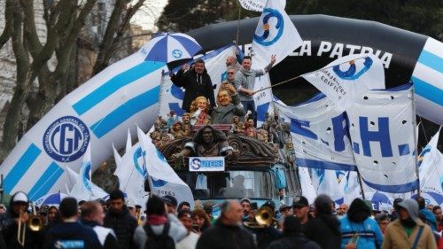 Demonstrators march towards the National Congress during a protest against the level of inflation ...