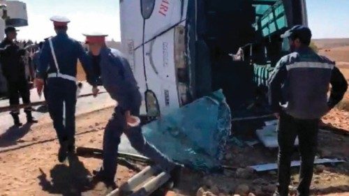 Security forces gather at the scene of a bus crash on a motorway in Khouribga province, east of ...