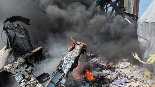 This photograph taken on August 19, 2022 shows a burning building of a chemical factory destroyed ...