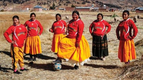A football team of Aymara indigenous women pose for a picture before a championship in the Aymara ...